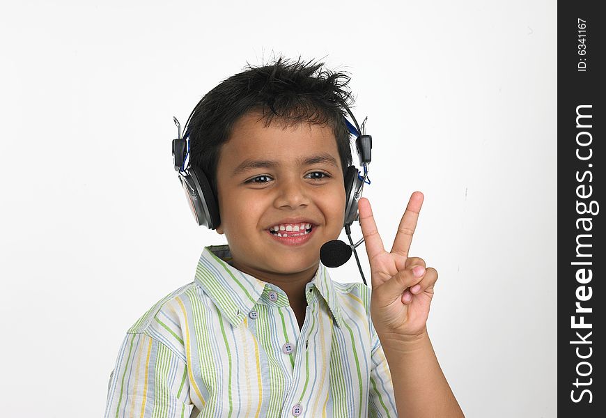Asian boy with headphones victory sign
