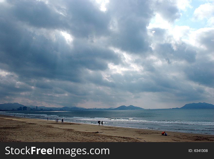 China, Hainan island with famous holiday resort Sanya. Beautiful sea side with wide and clean beach. China, Hainan island with famous holiday resort Sanya. Beautiful sea side with wide and clean beach.
