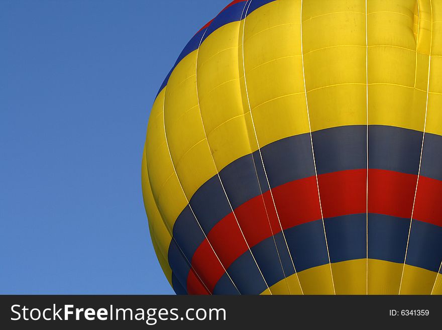 A red, yellow and blue hot air balloon at the annual Kannapolis, North Carolina Hot Air Balloon festival. A red, yellow and blue hot air balloon at the annual Kannapolis, North Carolina Hot Air Balloon festival