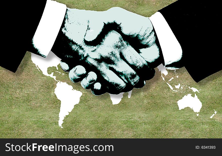 Businessmen handshaking over a wordl background. Businessmen handshaking over a wordl background.