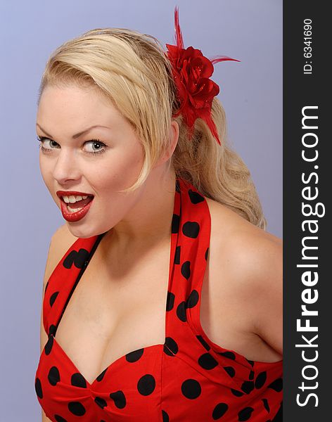 Gorgeous fifties burlesque blond in red polka-dot dress. Gorgeous fifties burlesque blond in red polka-dot dress