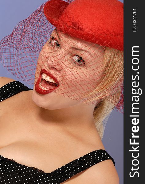 Excited Blond Girl In Red Hat