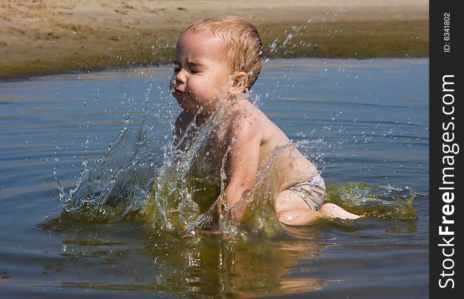 Cute little baby having fun at the sea. Cute little baby having fun at the sea