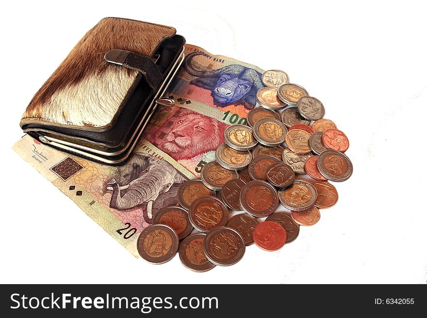 South African banknotes and coins with springbok skin purse, isolated against white. South African banknotes and coins with springbok skin purse, isolated against white