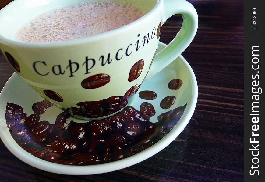 Cup of fragrant cappuchino in cafe