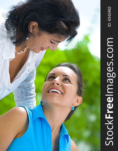 Portrait of  two beautiful women in summer environment. Portrait of  two beautiful women in summer environment