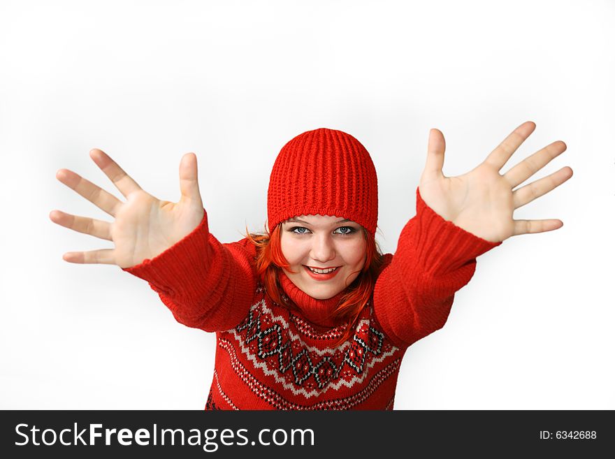 Happy girl with hands up in the red cap Against the white background.