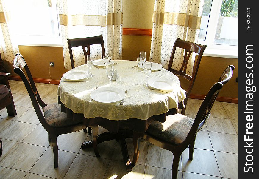 This is a picture of a table in a restaurant just before open of business. This is a picture of a table in a restaurant just before open of business.