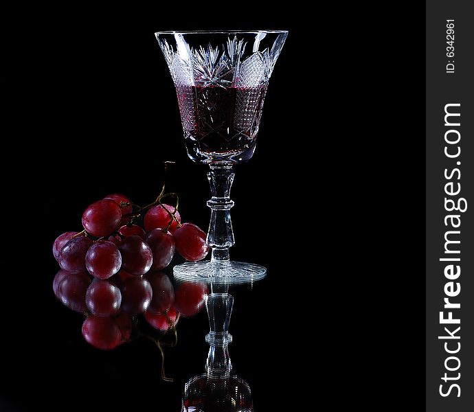 Red wine with red grapes