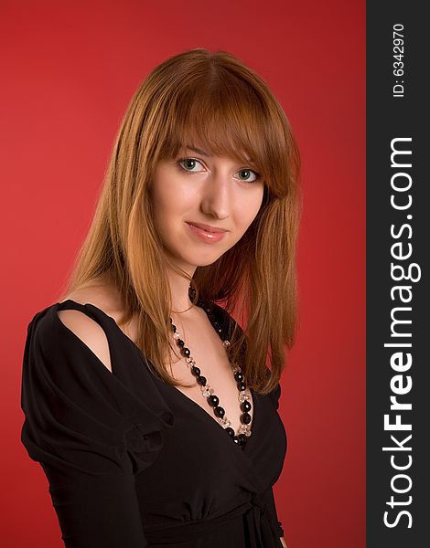 Portrait of a sensual girl isolated on red background