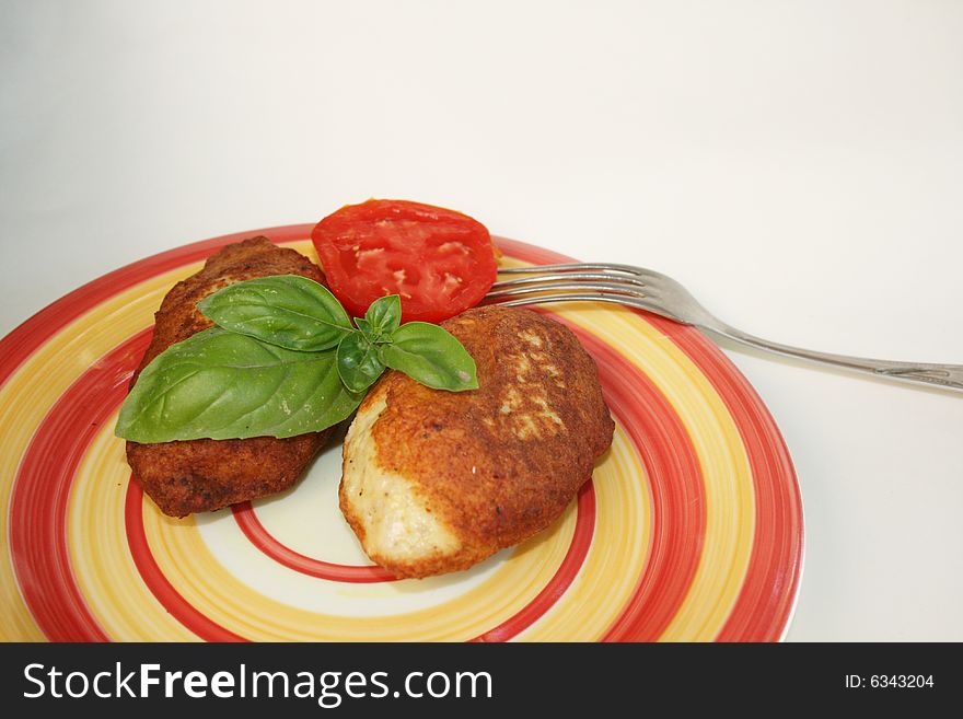 Juicy pork chops with a garnish from greens.