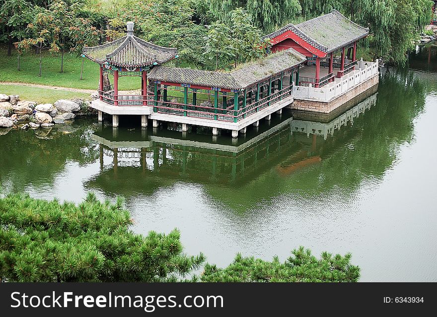 Beautiful pavilions beside the pond in a park. Beautiful pavilions beside the pond in a park.