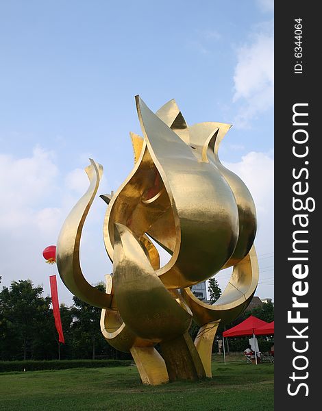 A setallic sculpture at the center of Nanjing City on the ground