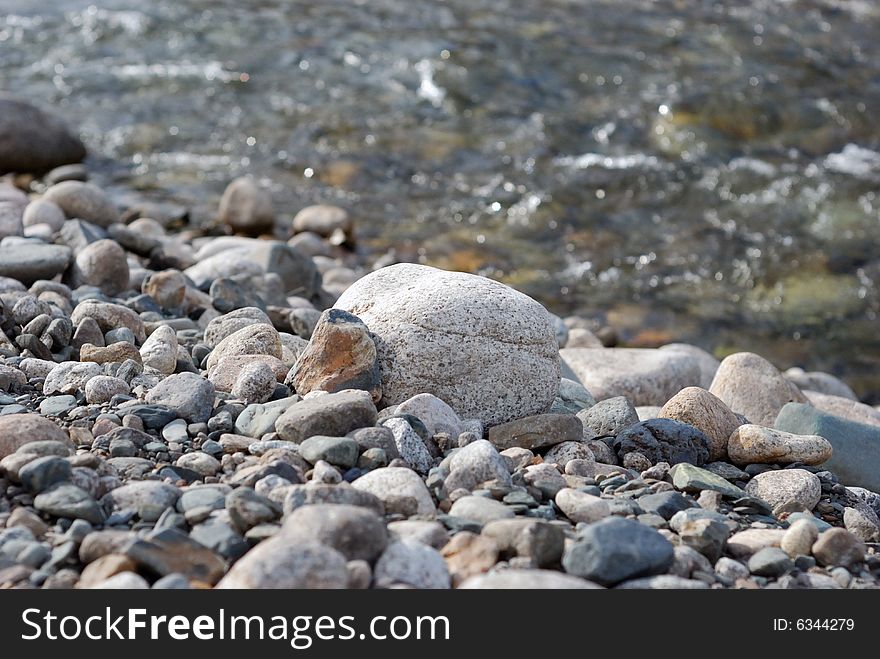 Stones on the bank of the mountain river. Stones on the bank of the mountain river