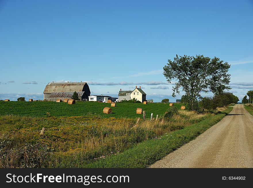 A typical homestead on a country lane in central Ontario during late summer. A typical homestead on a country lane in central Ontario during late summer.