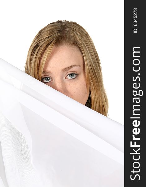 Woman Looking Over White Pillow