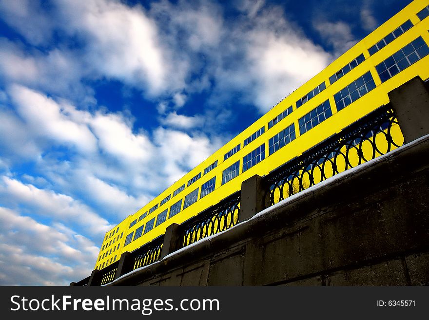 Photo of the main facade of yellow modern building. Photo of the main facade of yellow modern building