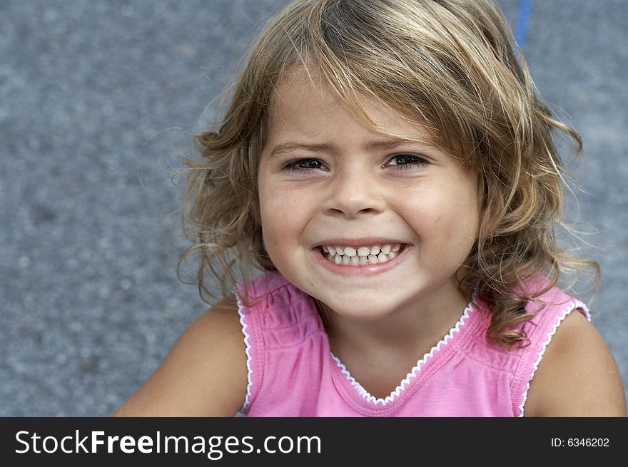 A picture of a cute little girl smiling. A picture of a cute little girl smiling