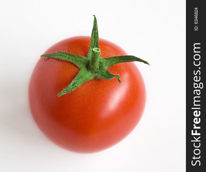 Isolated red tomato on the white background