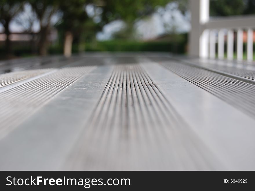 A metal park table with medium focus. A metal park table with medium focus