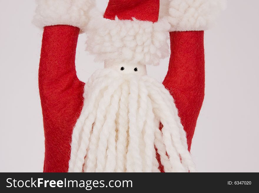 A yarn and felt hand crafted Santa Claus.