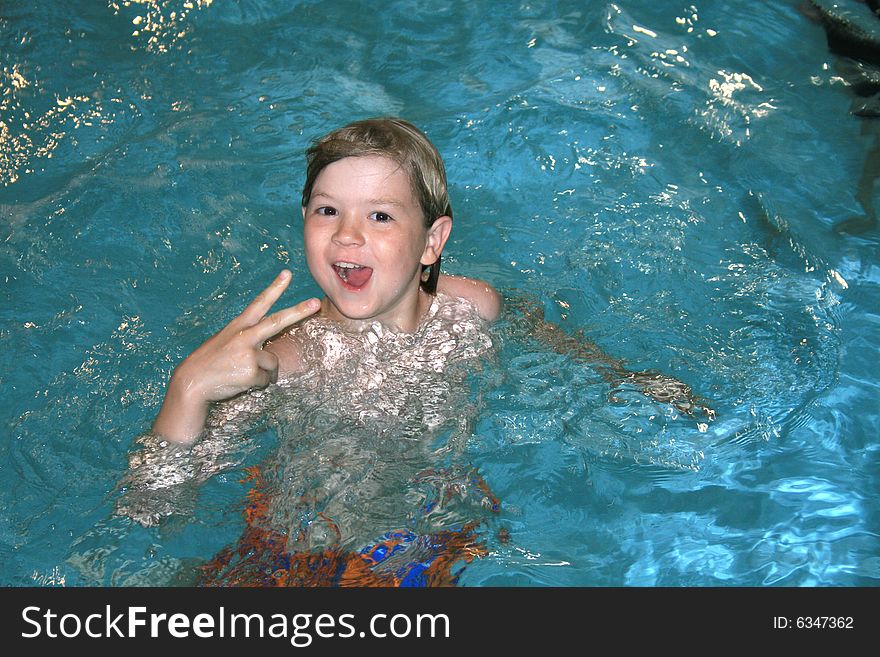 Boy swimming in the pool. Boy swimming in the pool