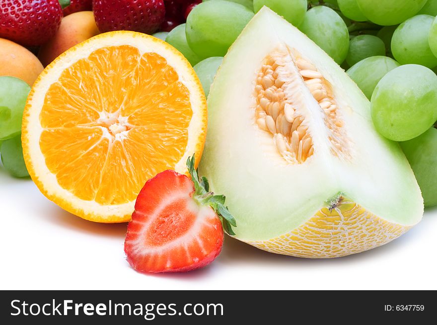 Slice fresh fruits on white background