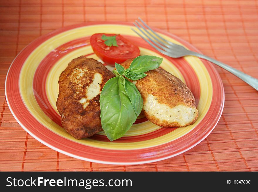 Juicy Pork Chops With A Garnish From Greens.