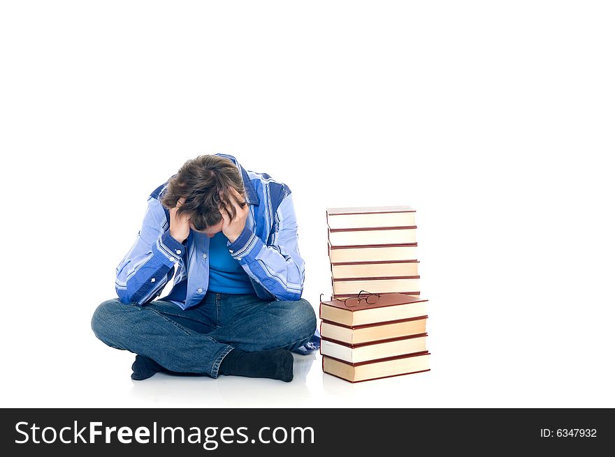 Teenager schoolboy with books on white background