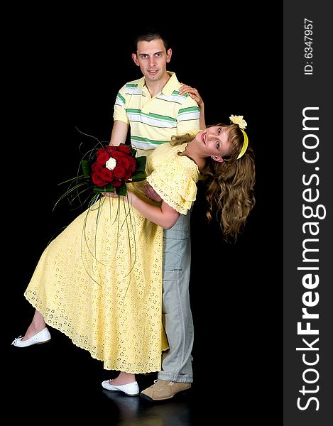 Young happy laughing wedding couple on black background, studio shot. Young happy laughing wedding couple on black background, studio shot