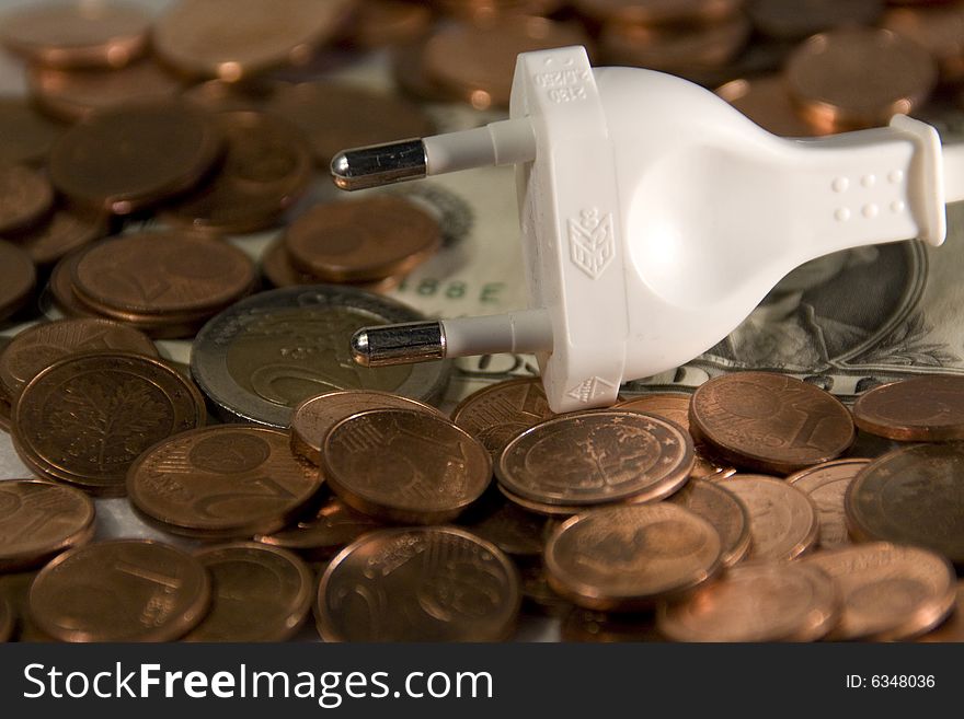 euro coins and a power plug