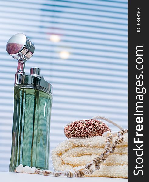 Bath background with perfume, towel and seashells. Bath background with perfume, towel and seashells