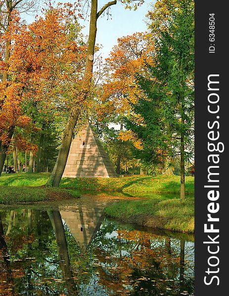 Northern pyramid in autumn day near water