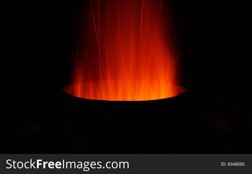 Sparks and fire coming out of the top of a chiminea