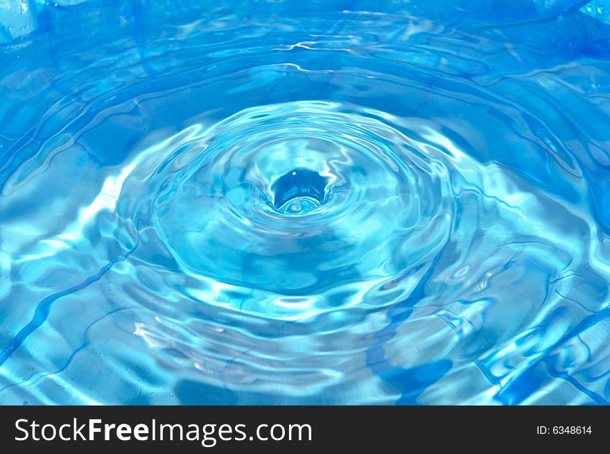 Round hole on the rippled water surface. Round hole on the rippled water surface