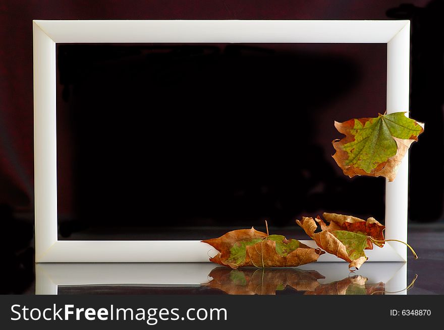 Frame with autumnal leaves against the black background. Frame with autumnal leaves against the black background