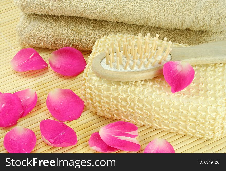 Beige terry towel and hairbrush