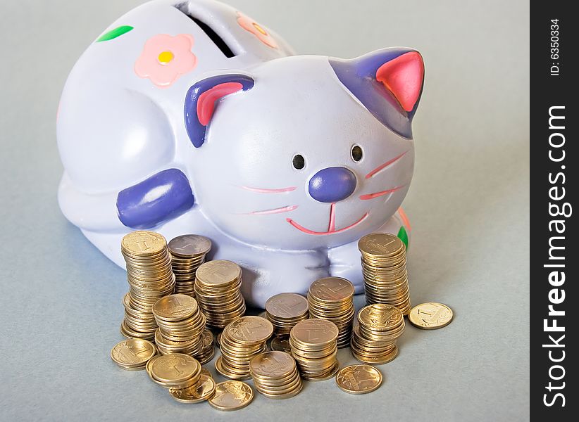 Blue cat - moneybox with columns of coins