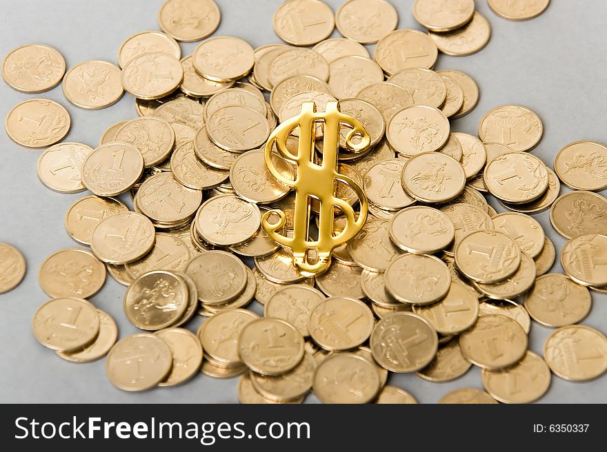 A photo of dollar sign with coins. A photo of dollar sign with coins