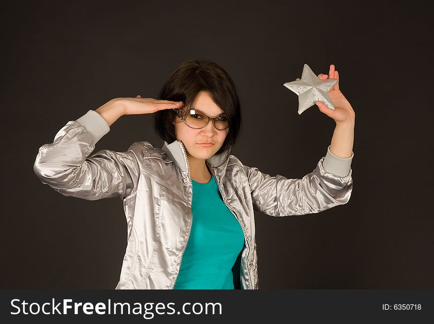 Fashion Girl In Silver Jacket Holding Star