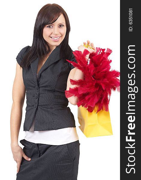 Portrait of a beautiful young brunette woman holding a shopping bag with red fur in it. Isolated on white background. Portrait of a beautiful young brunette woman holding a shopping bag with red fur in it. Isolated on white background