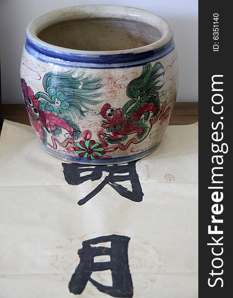 A pottery jar and calligraphy