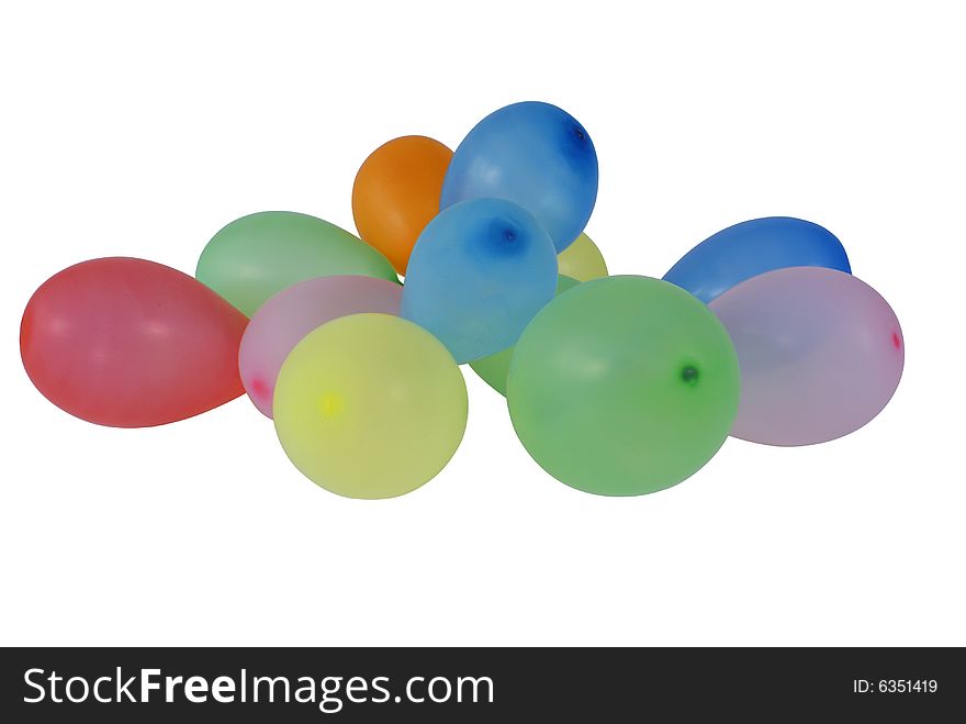 Spilled small colorful balloons isolated on white background