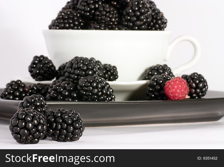 Macro view of fresh ripe blackberries in the bowl. Macro view of fresh ripe blackberries in the bowl