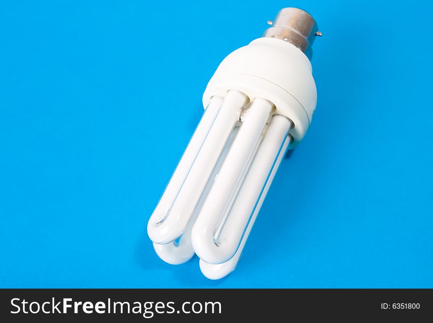 Energy saving bulb on blue background