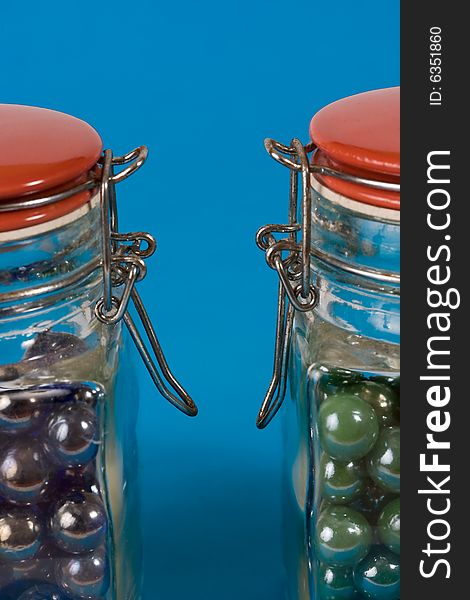 Two glass jars with red lids