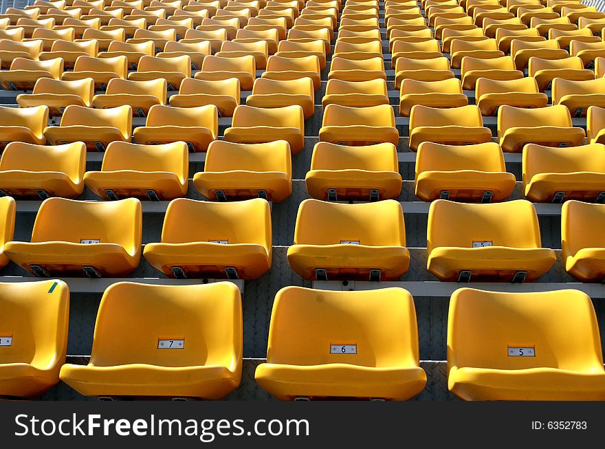 The stand with yellow seats. The stand with yellow seats