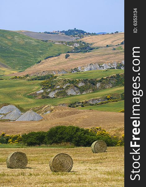 Tuscany countryside, hayball on the meadow