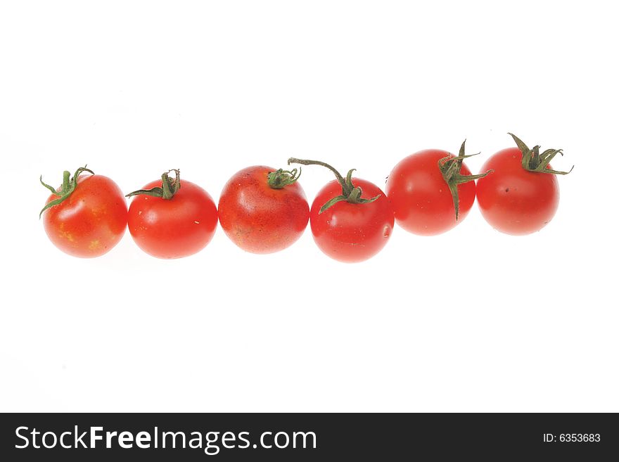Fresh homegrown cherry tomatoes on white