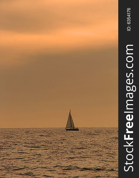 A sailboat at sea in the Pacific Ocean. Nearest port is Los Cabos, Mexico. A sailboat at sea in the Pacific Ocean. Nearest port is Los Cabos, Mexico.